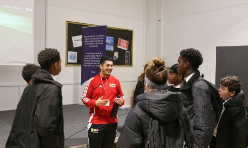 Year 9 students talking with Former Arsenal FC Coach Steve Eadon